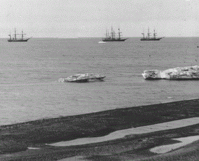 View of four three-masted whaling ships offshore from Barrow, Alaska. Image: Alaska State Library