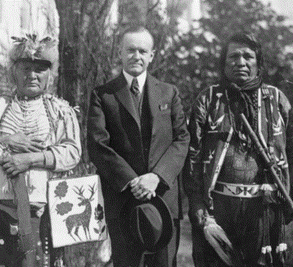 President Coolidge with four Osage Indians after signing the Indian Citizenship Act. Image: Library of Congress